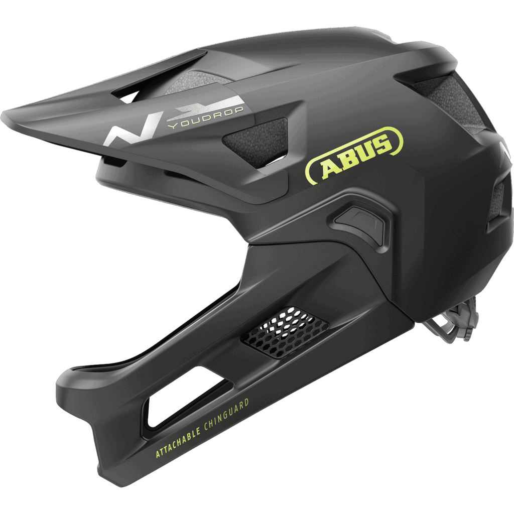 Der Abus Youdrop FF ist ein mattschwarzer Fullface-MTB-Helm mit Lüftungsschlitzen, gelbem Abus-Logo, "ATTACHABLE CHINGUARD"-Schriftzug im Kinnbereich, abnehmbarem Kinnbügel, aerodynamischem Design und robuster Konstruktion.