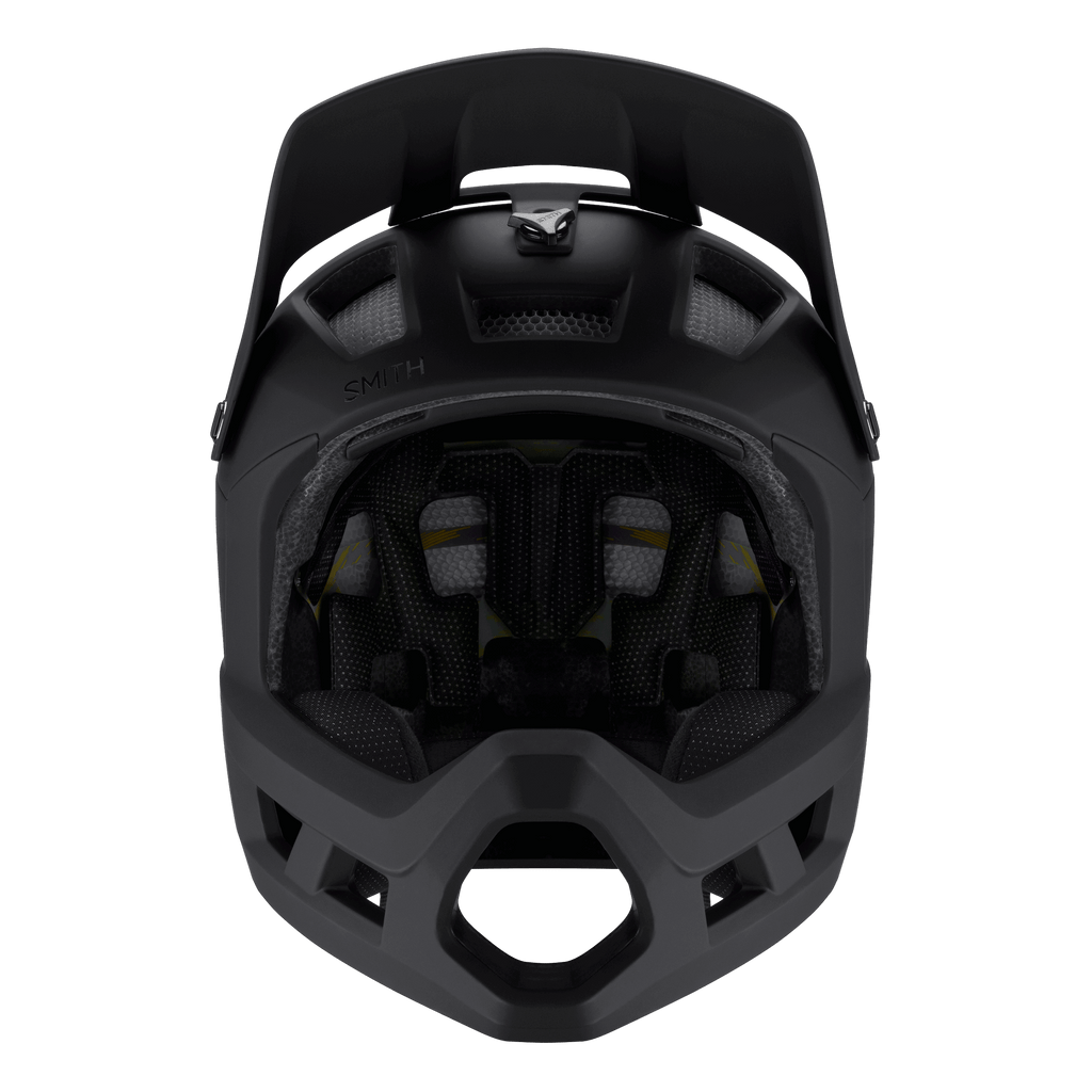 Vorderansicht eines schwarzen Smith - Mainline Mips Integralhelms von Smith, entwickelt für Radfahren und Motocross, mit MIPS- und Koroyd®-Technologie, Innenpolsterung und Belüftungsöffnungen; fotografiert vor einem schwarzen Hintergrund.