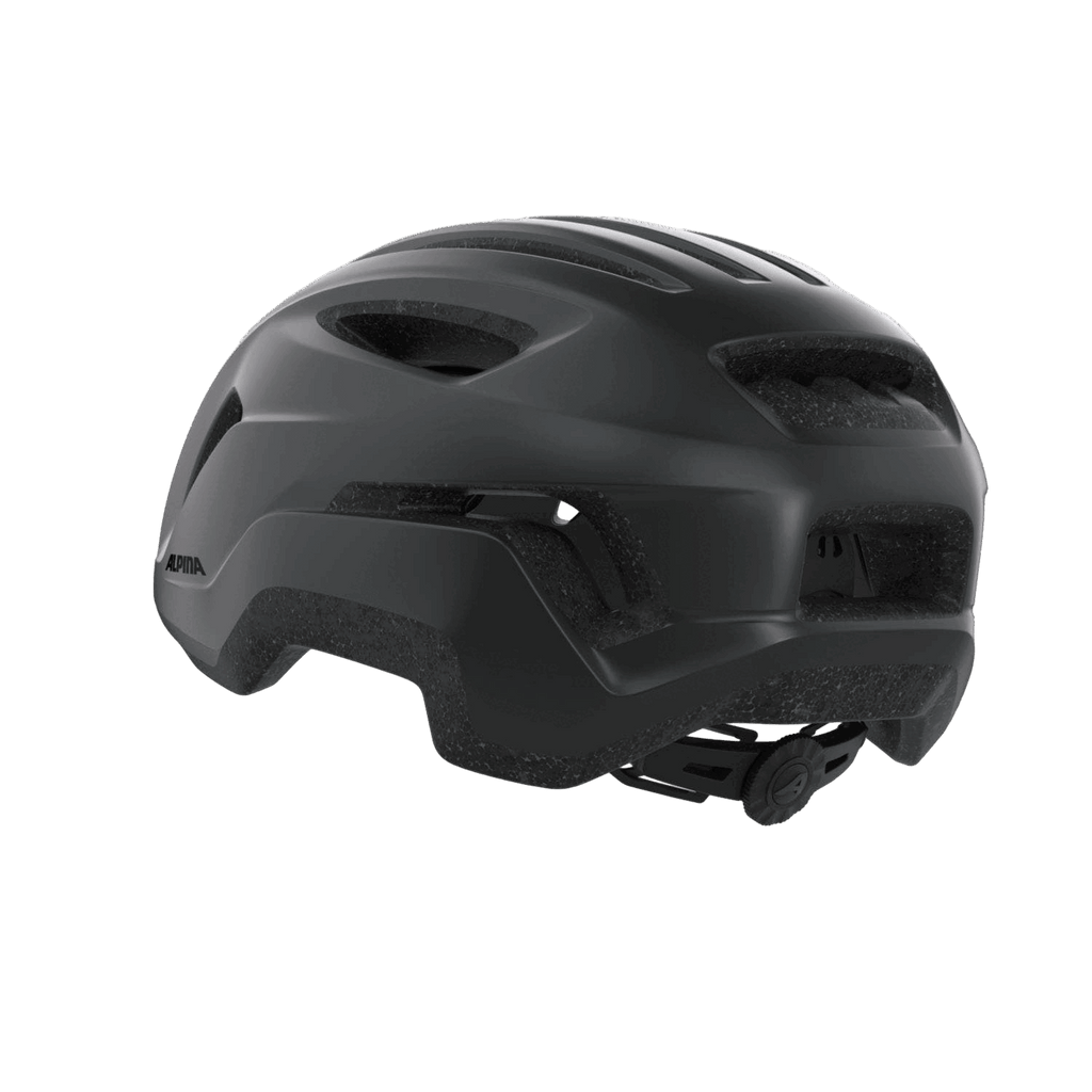 Der Alpina - Paranus Urban Helm von Alpina zeigt sich von hinten in mattem Schwarz mit mehreren Belüftungsöffnungen, einem strukturierten unteren Rand und einem verstellbaren Einstellrad für die Passform vor einem grauen Hintergrund.