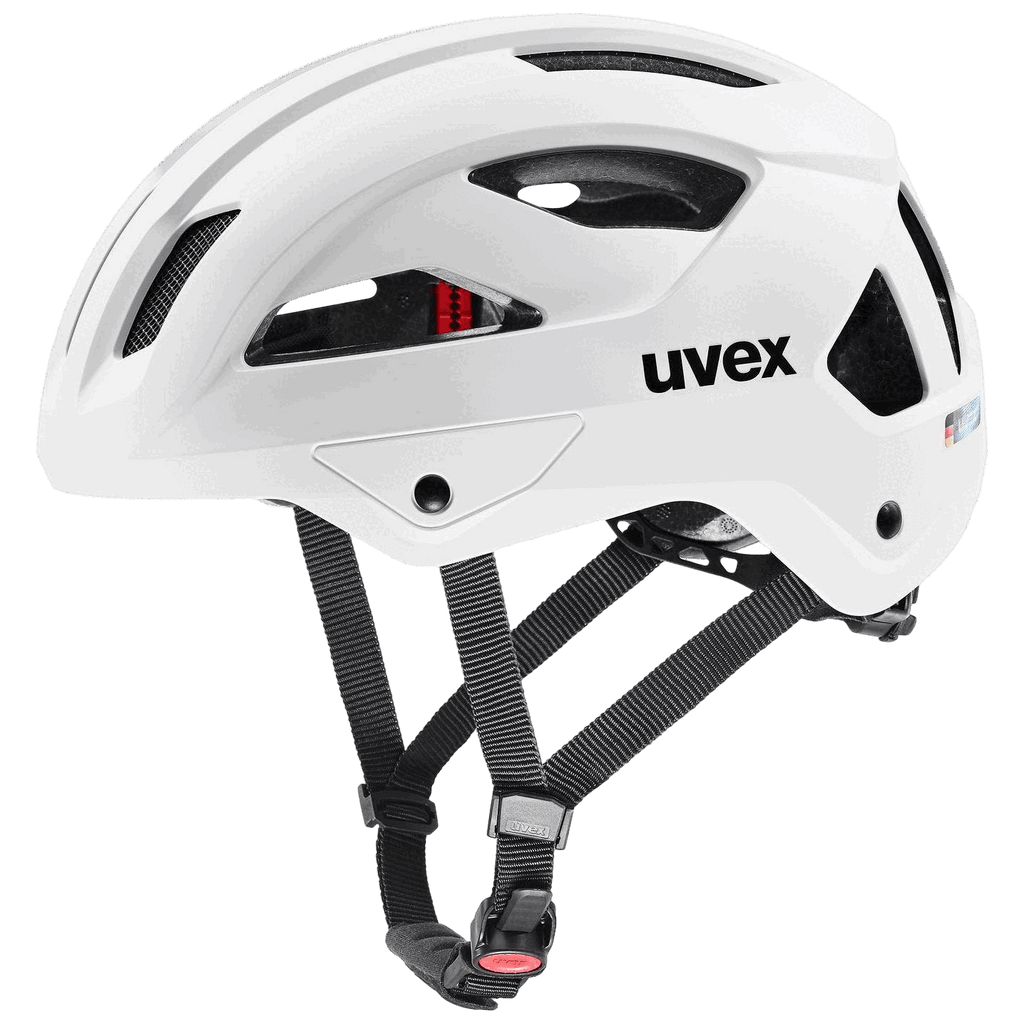 Der Uvex Stride Helm von Uvex wird von der Seite auf einem transparenten Hintergrund gezeigt. Er verfügt über eine weiße Hartschale, mehrere Belüftungslöcher, schwarze verstellbare Riemen und eine rote Schnalle.