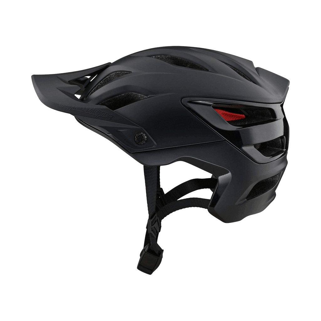 Der Troy Lee Designs A3 Mips Helm ist ein mattschwarzer Mountainbike-Helm mit Magnajust®-Visier, Belüftungsöffnungen, MIPS-Schutz und verstellbaren Riemen, abgebildet auf einem dunklen Hintergrund.