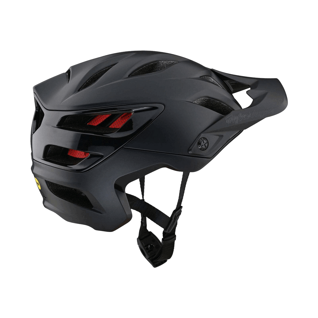 Der Troy Lee Designs A3 Mips Helm in mattem Schwarz mit roter Innenpolsterung verfügt über Belüftungsschlitze, MIPS-Sicherheitstechnologie und ein Magnajust® Visier, das von hinten und von der Seite vor einem schwarzen Hintergrund gezeigt wird.
